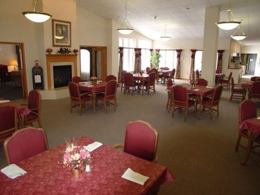 Dining area with tables and floral arrangements