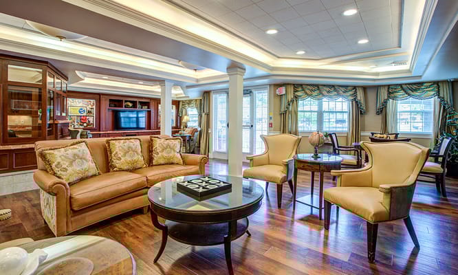 Cozy living room with brown sofa and two chairs