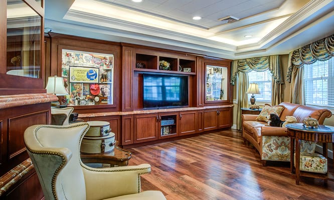 Inviting living room with wooden furniture and a television.