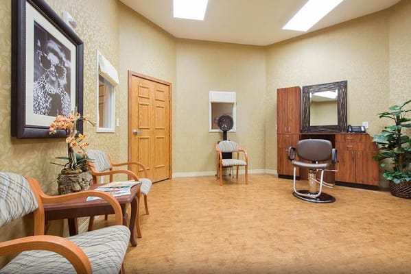 Interior view of the salon with seating and styling station