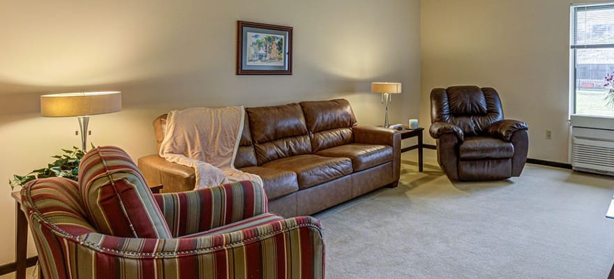 Cozy common area with chairs and lamps