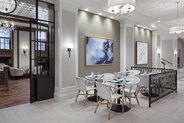 Dining area with elegant decor and tables set