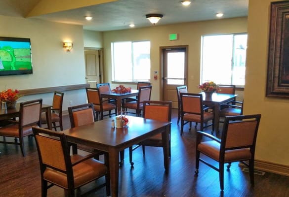 Bright dining area with tables and chairs