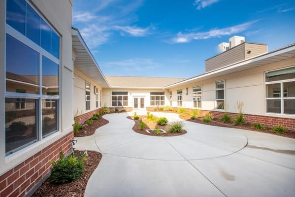 Pathway through a landscaped courtyard at an assisted living facility