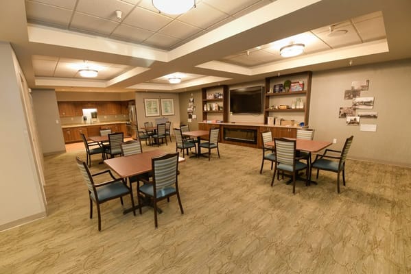 Bright interior common area with tables and chairs