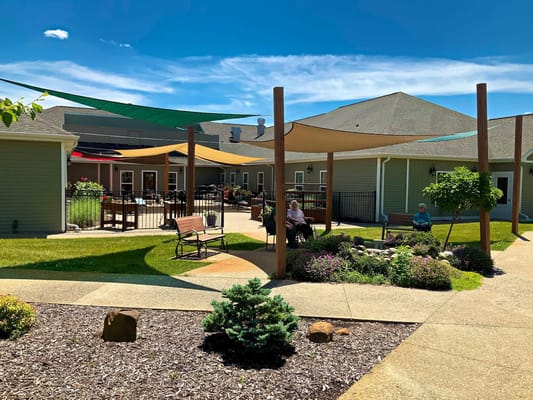 Patio with shaded seating at Vicinia Gardens