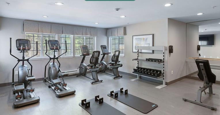 Well-equipped fitness room with exercise machines
