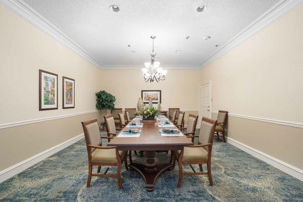 Elegant dining room setup with a long table and chairs