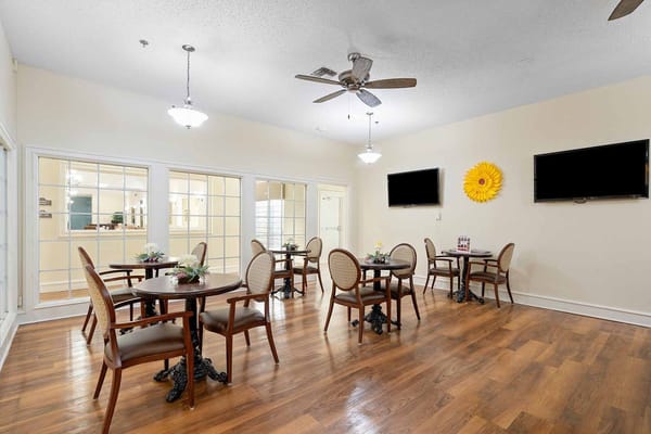 Cozy dining area with tables and chairs at Waterside Landing.