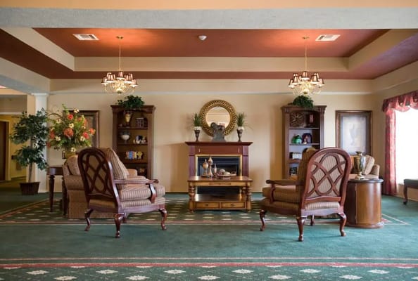 Cozy common area with armchairs and decorative shelves
