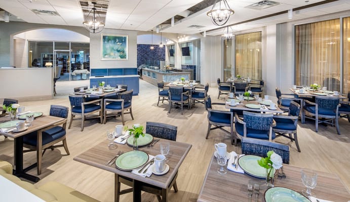 Modern dining room with tables set for meals