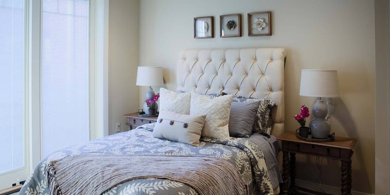 Cozy bedroom with a floral theme and decorative pillows