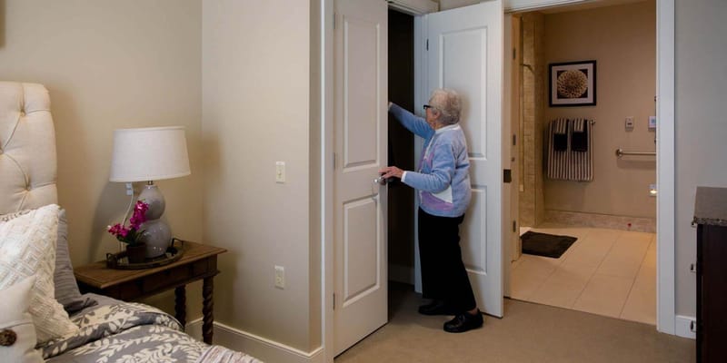 A resident entering a private room in the facility