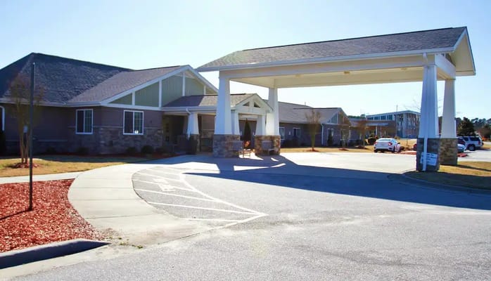 Entrance view of Wickshire Creeks Crossing senior living facility