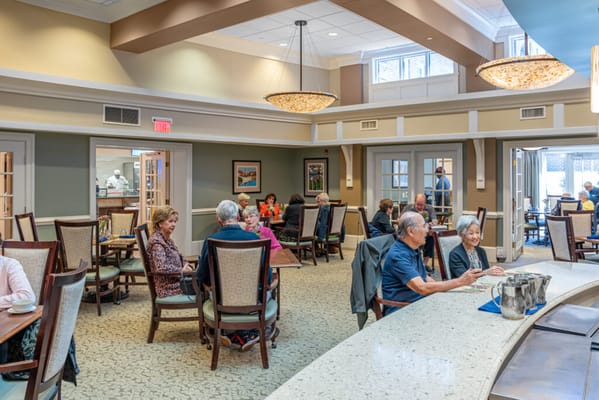 Residents enjoying a meal in the dining area