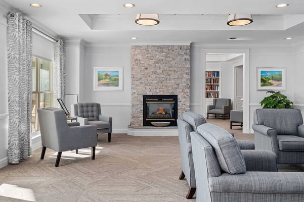 Common area with comfortable seating and a fireplace