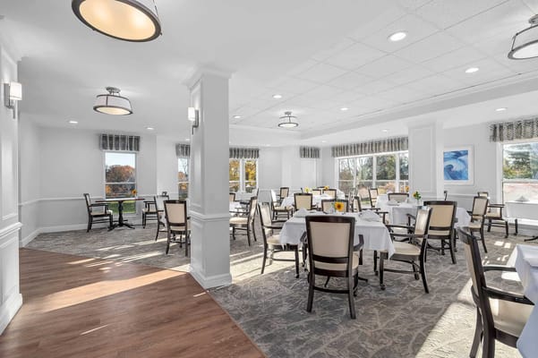Bright dining room with arranged tables and chairs
