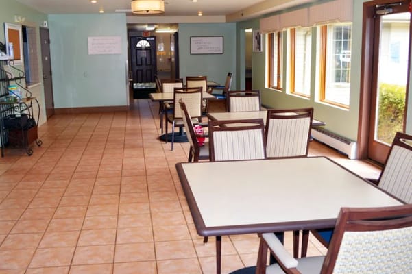 Bright dining area with tables and chairs
