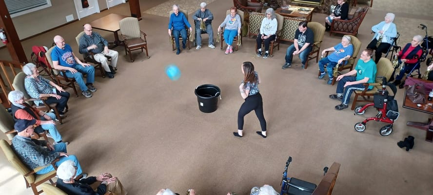 Residents participating in a group activity in a common area