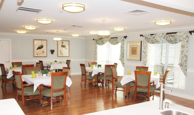 Dining room with set tables and decorated windows