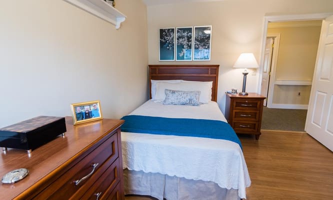 Cozy private room with a bed and dresser