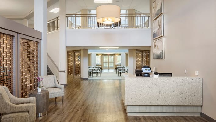 Bright lobby area with seating and dining space