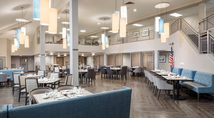 Bright dining room setup with tables and chairs