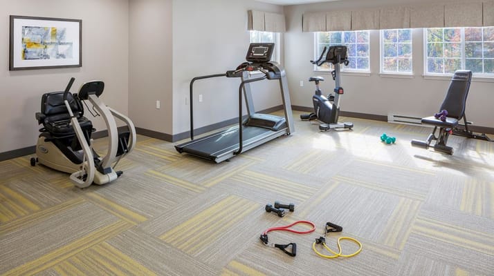 Well-equipped fitness room with exercise machines