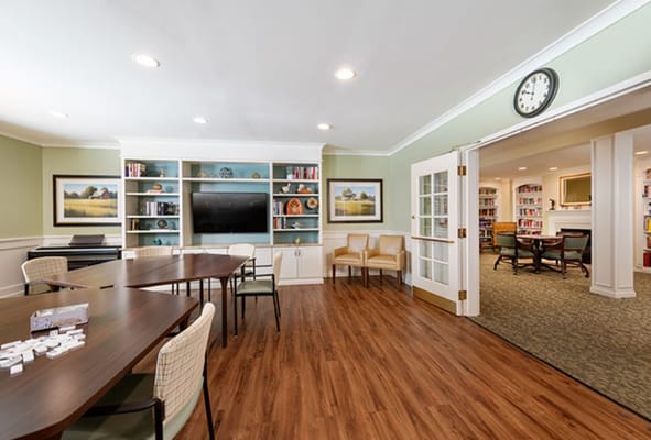 Bright common area with seating and shelves