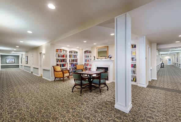 Interior view of a cozy common area with bookshelves
