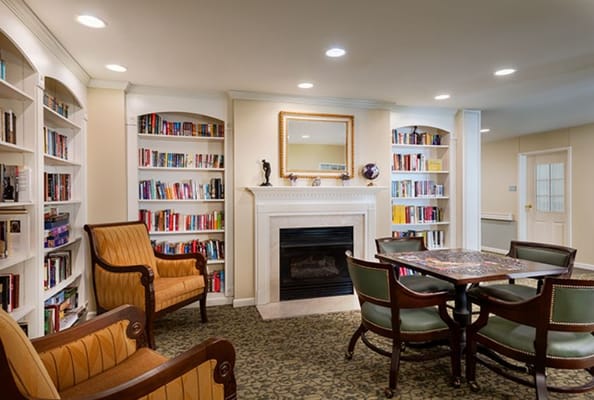 Cozy common area with bookshelves and seating
