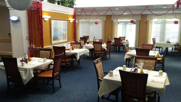 Dining area set up for residents with festive decor