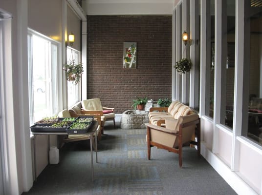 Bright common area with seating and plants