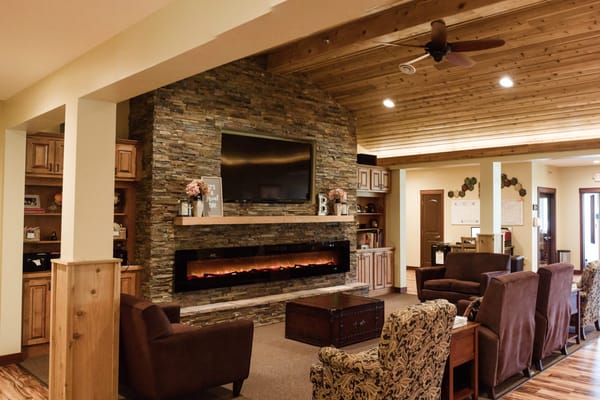 Comfortable lounge area with a stone fireplace
