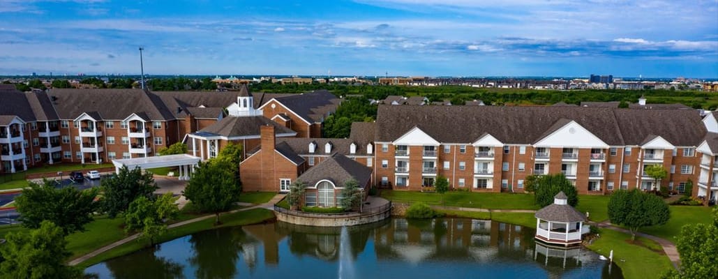 Aerial view of the facility with lake and gardens