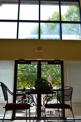 View of an exit door with outdoor seating visible