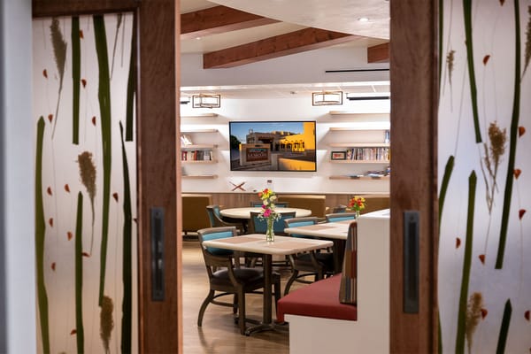 View of a common area with tables and flowers