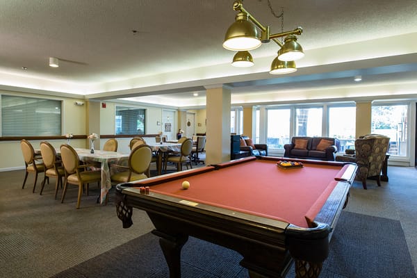Interior view of a recreational area with a pool table