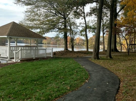 Pathway leading to a gazebo by the lake
