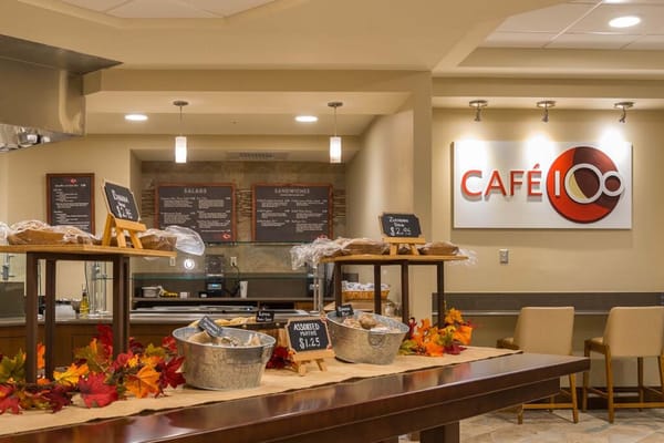 Dining area with food and café signage