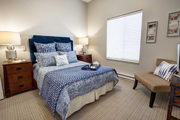 Cozy private resident room with bed and decor