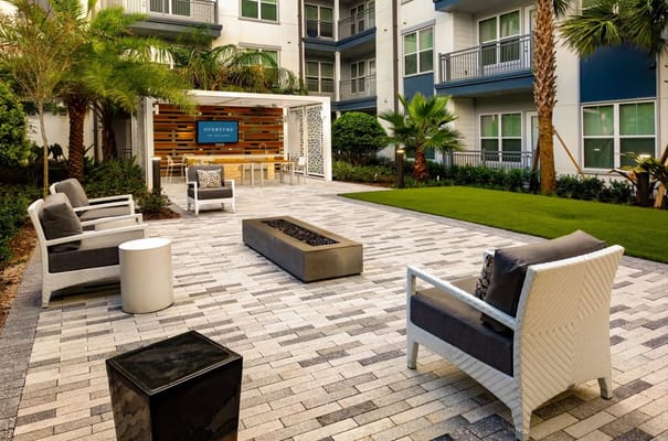 Outdoor seating area with fire pit in a landscaped courtyard