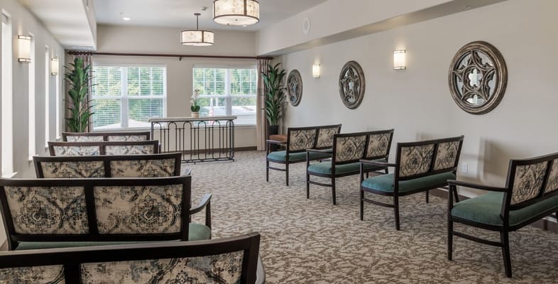 Comfortable seating in the lounge area with natural light and decor