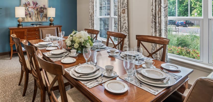 Elegant dining table set for meals with floral centerpiece