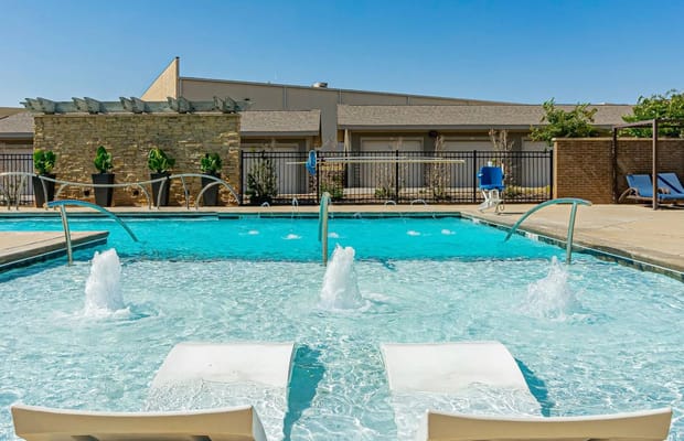 Swimming pool area with splashing water features
