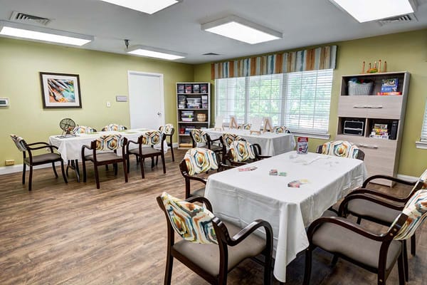 Bright common area with tables and chairs