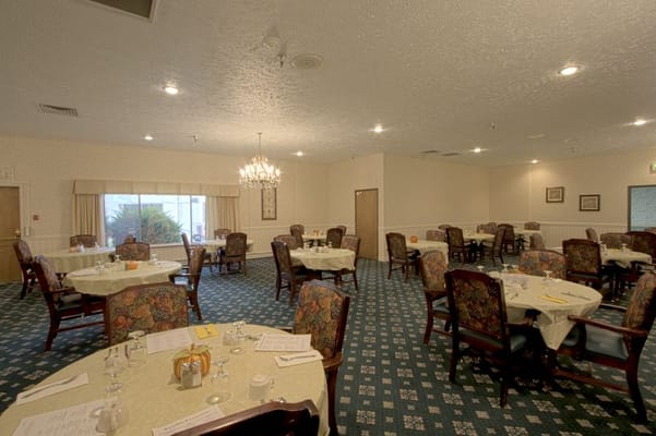 Dining area with tables set for residents