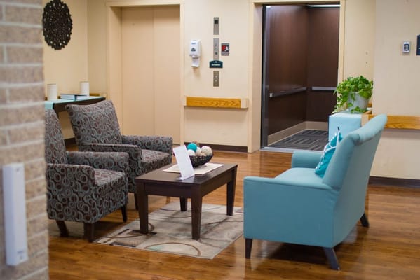 Seating area in the lobby with chairs and a coffee table