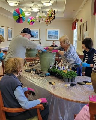 Residents participating in a gardening activity indoors