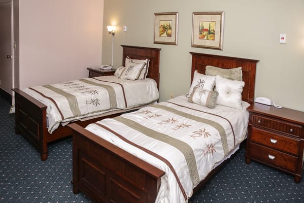 A well-furnished resident room with two beds